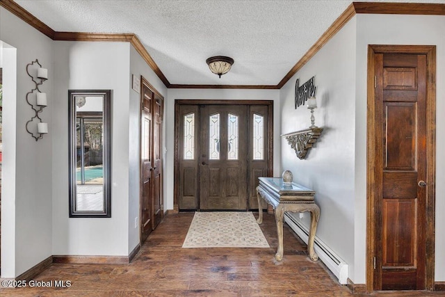 foyer entrance featuring a baseboard heating unit, a textured ceiling, a wealth of natural light, and dark wood-style flooring