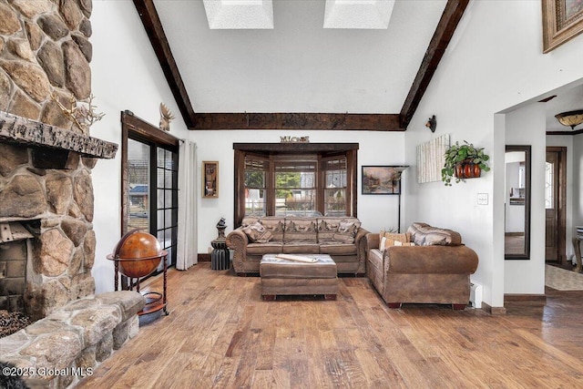 living room featuring high vaulted ceiling, wood finished floors, and beam ceiling