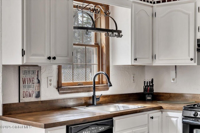 kitchen with butcher block counters, black gas range, dishwashing machine, and a sink