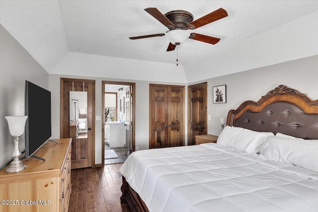 bedroom featuring connected bathroom, ceiling fan, dark wood-style flooring, and a textured ceiling