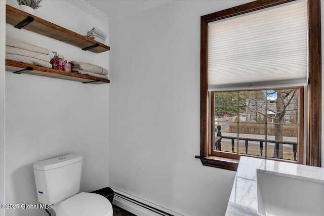 bathroom with a baseboard radiator, toilet, and ornamental molding