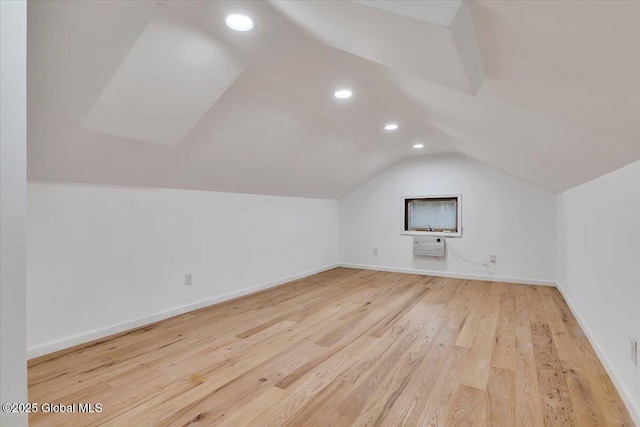 bonus room featuring recessed lighting, lofted ceiling, baseboards, and light wood-style flooring