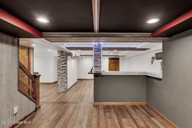 interior space with indoor bar, baseboards, wood finished floors, and recessed lighting