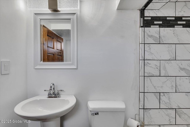 bathroom with a sink and toilet