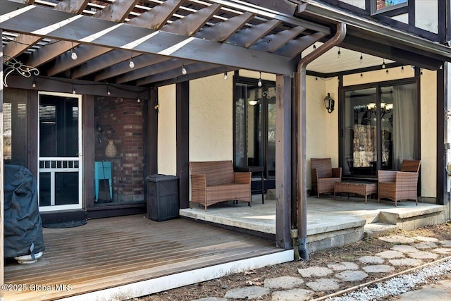 wooden deck featuring a pergola