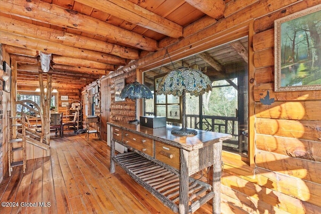 office area featuring beamed ceiling, hardwood / wood-style flooring, wooden ceiling, and rustic walls
