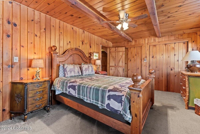 bedroom featuring beamed ceiling, wooden walls, wooden ceiling, and carpet floors