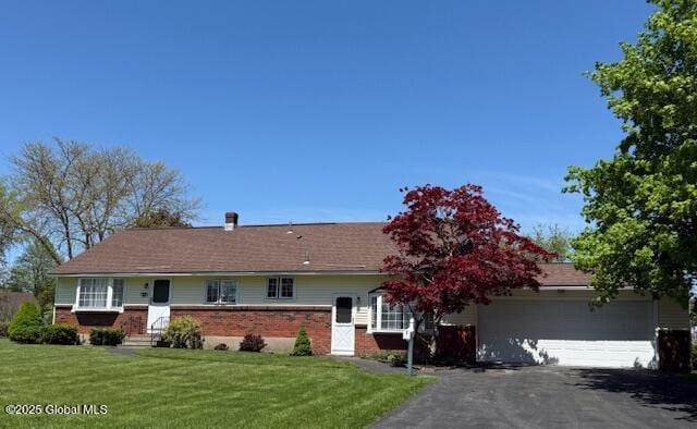 42 E Maynes Ave, Guilderland, NY 12203 - ranch-style home with a garage, driveway, brick siding, and a front yard