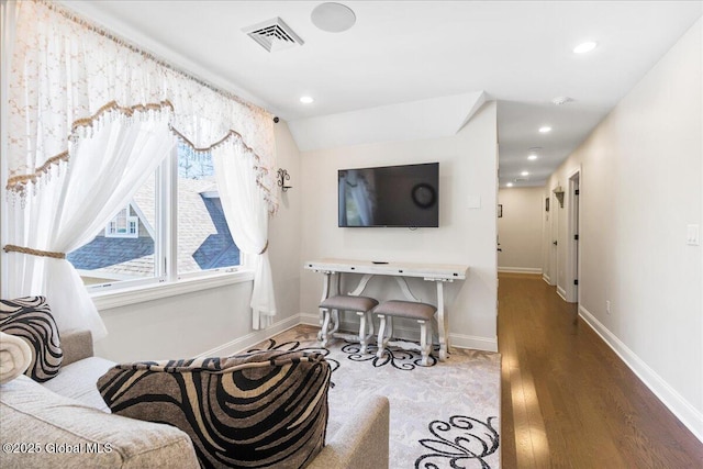 living room with baseboards, recessed lighting, wood finished floors, and visible vents