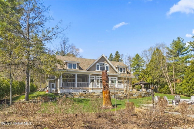 view of front of home featuring a gazebo and a sunroom