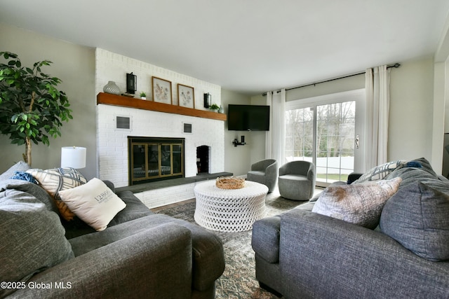 362 Lake Ave, Saratoga Springs, NY 12866 - living room with visible vents, wood finished floors, and a fireplace
