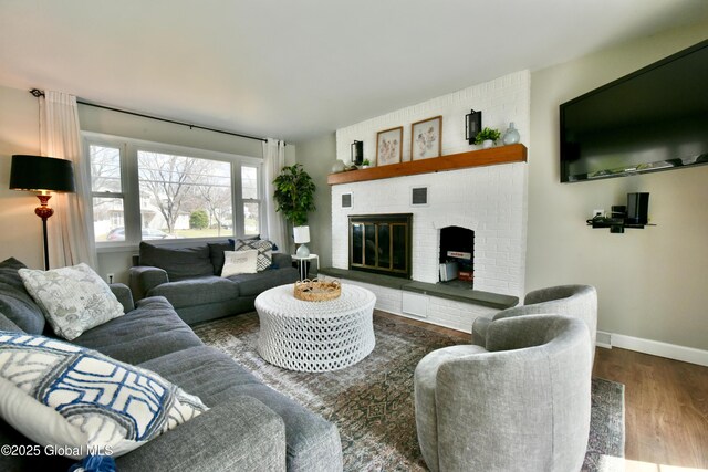 362 Lake Ave, Saratoga Springs, NY 12866 - living room with a brick fireplace, baseboards, and wood finished floors