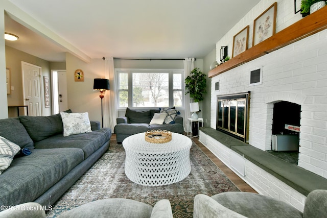 362 Lake Ave, Saratoga Springs, NY 12866 - living room featuring a fireplace, dark wood finished floors, and visible vents