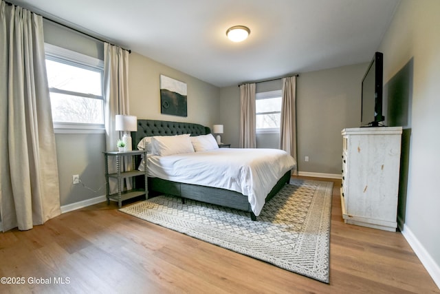 362 Lake Ave, Saratoga Springs, NY 12866 - bedroom featuring baseboards, multiple windows, and wood finished floors