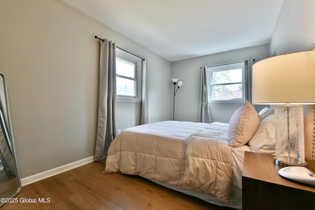 362 Lake Ave, Saratoga Springs, NY 12866 - bedroom featuring baseboards, multiple windows, and wood finished floors