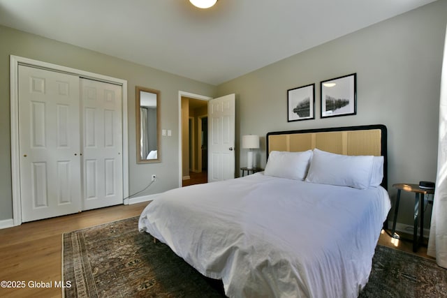 362 Lake Ave, Saratoga Springs, NY 12866 - bedroom featuring baseboards, wood finished floors, and a closet