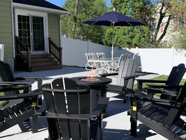 362 Lake Ave, Saratoga Springs, NY 12866 - view of patio / terrace with outdoor dining area, an outdoor fire pit, fence, and entry steps