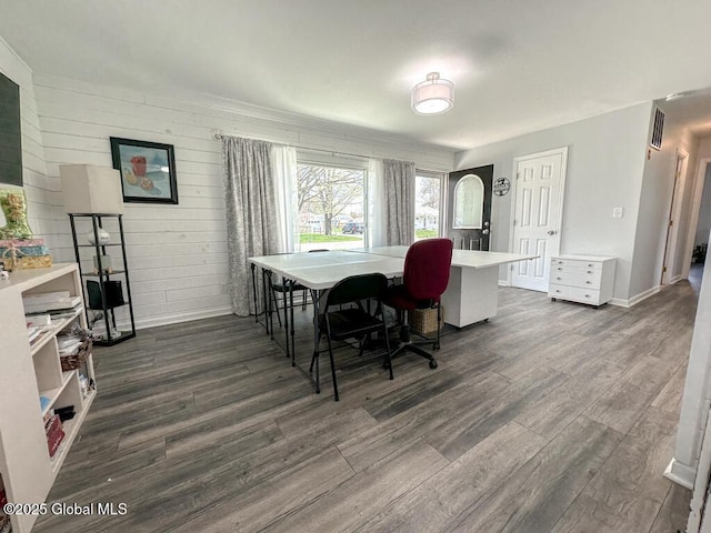 dining room featuring baseboards, visible vents, and dark wood-type flooring