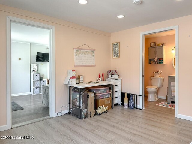 interior space featuring recessed lighting, light wood finished floors, and baseboards