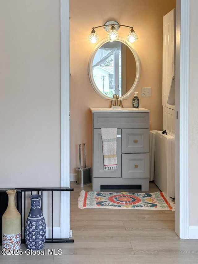 bathroom featuring wood finished floors and vanity