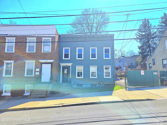 multi unit property featuring brick siding and entry steps
