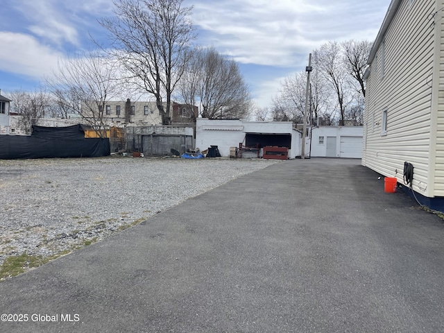 view of street featuring aphalt driveway