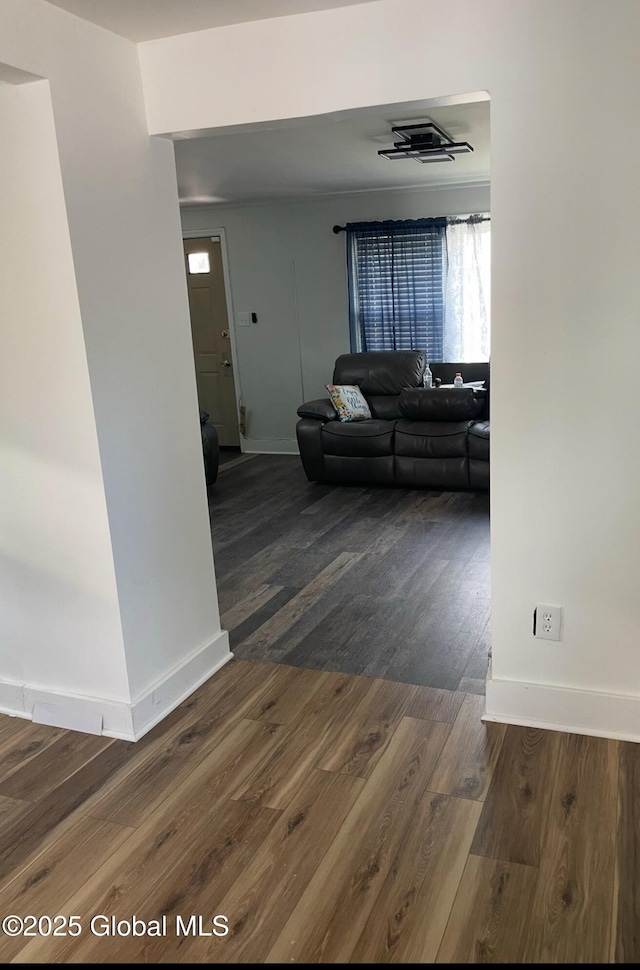 living area featuring wood finished floors and baseboards