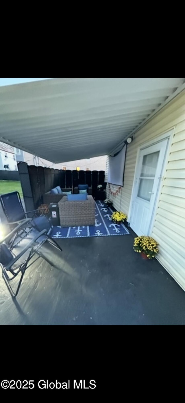 view of patio / terrace with an attached carport