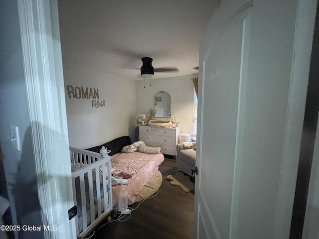 bedroom with wood finished floors and ceiling fan