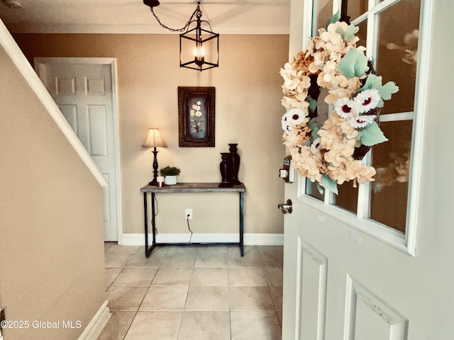 8 Treasures Pl, Queensbury, NY 12804 - foyer entrance with light tile patterned flooring, a chandelier, and baseboards