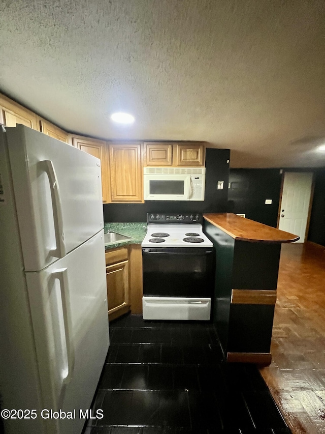 66 Jefferson St, Troy, NY 12180 - kitchen with white appliances, a textured ceiling, recessed lighting, and a sink