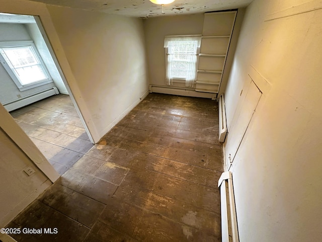 230 S Rd, Stephentown, NY 12018 - unfurnished room featuring a baseboard radiator, plenty of natural light, and a baseboard heating unit