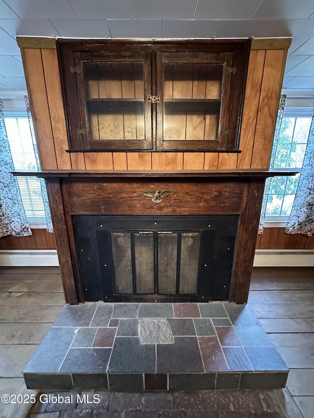 230 S Rd, Stephentown, NY 12018 - detailed view of a baseboard heating unit, a tile fireplace, and a baseboard radiator