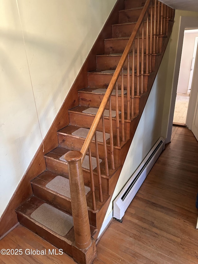 230 S Rd, Stephentown, NY 12018 - stairway featuring a baseboard radiator and wood finished floors