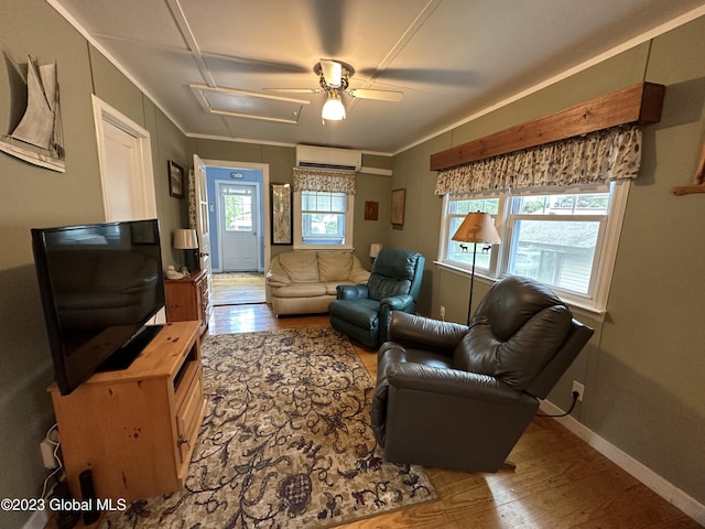 6325 Sunset Bay Rd, Dresden, NY 12841 - living area featuring wood finished floors, an AC wall unit, ornamental molding, baseboards, and ceiling fan