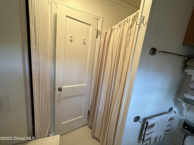 6325 Sunset Bay Rd, Dresden, NY 12841 - bathroom featuring a shower with shower curtain and tile patterned floors