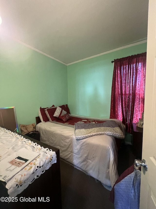 bedroom with crown molding
