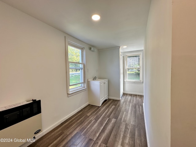 washroom with a healthy amount of sunlight, recessed lighting, and dark wood-style flooring