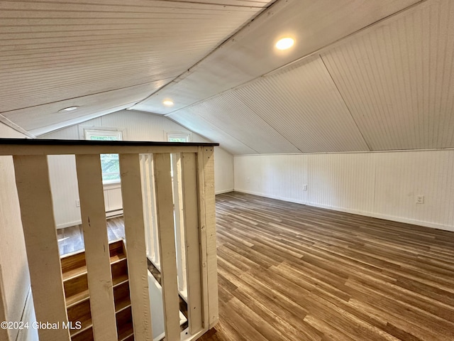 additional living space with wood finished floors, lofted ceiling, baseboards, and wooden ceiling