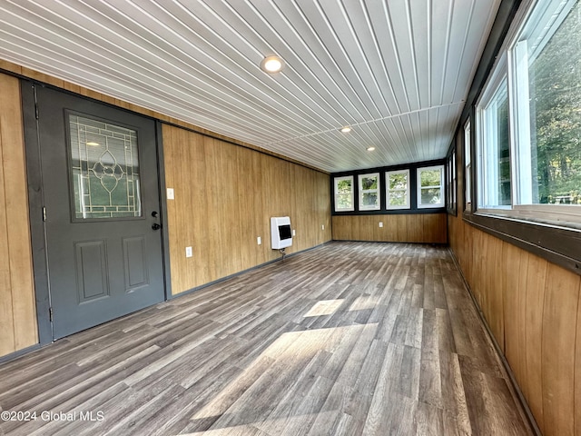 unfurnished sunroom featuring heating unit