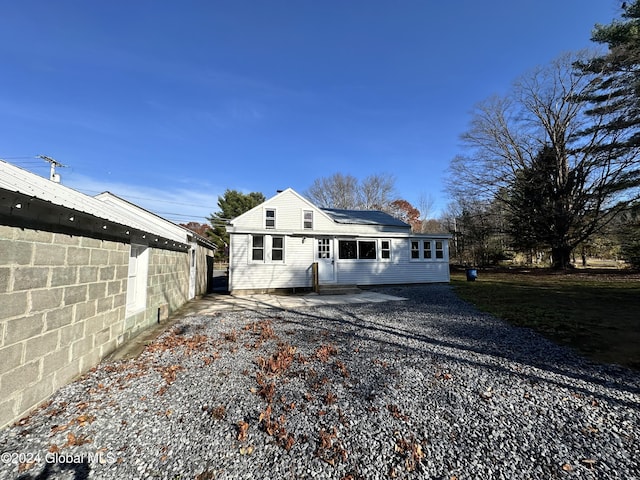 rear view of house with fence