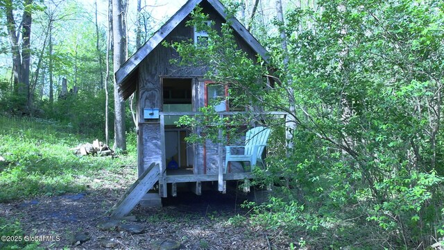 116 Dennie Rd, Mayfield, NY 12117 - view of outdoor structure featuring a forest view