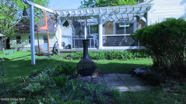116 Dennie Rd, Mayfield, NY 12117 - rear view of property featuring a pergola, a lawn, and a sunroom