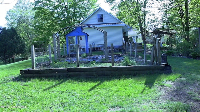 116 Dennie Rd, Mayfield, NY 12117 - back of house with a lawn and a garden