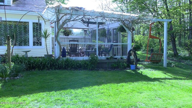 116 Dennie Rd, Mayfield, NY 12117 - rear view of house with a lawn and a sunroom