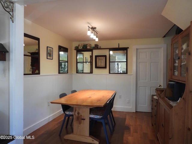 116 Dennie Rd, Mayfield, NY 12117 - dining area with dark wood-style floors, wainscoting, and baseboards