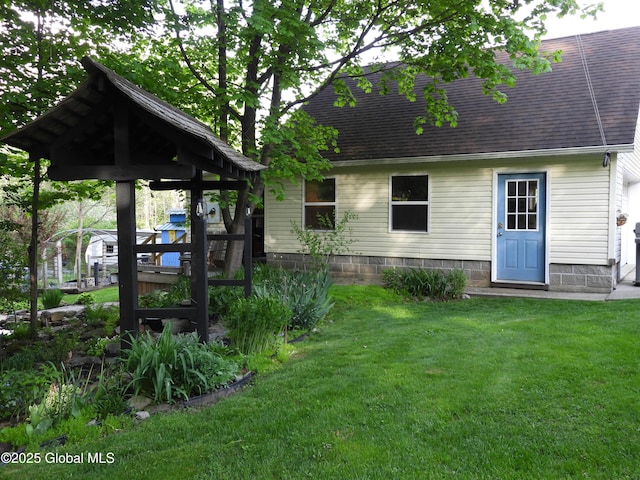 116 Dennie Rd, Mayfield, NY 12117 - back of house featuring a lawn, roof with shingles, and a gazebo