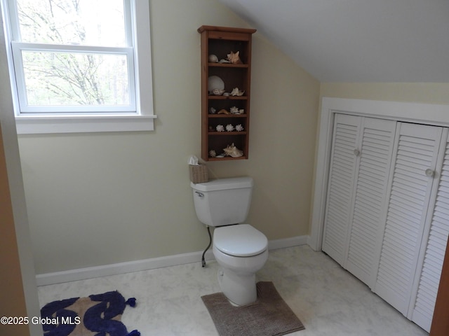 116 Dennie Rd, Mayfield, NY 12117 - bathroom featuring toilet, lofted ceiling, a closet, and baseboards