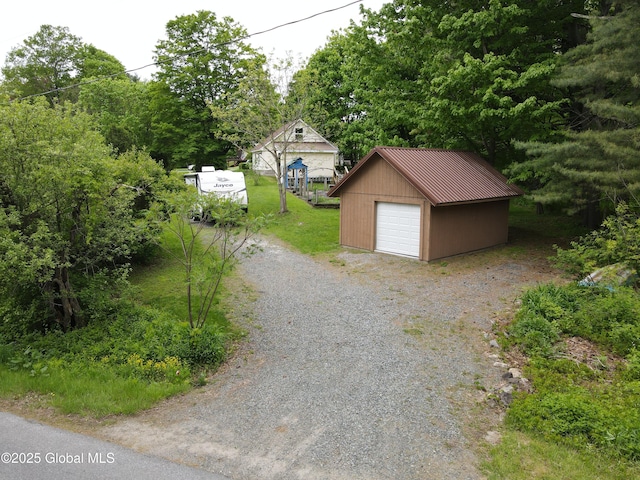116 Dennie Rd, Mayfield, NY 12117 - detached garage featuring gravel driveway