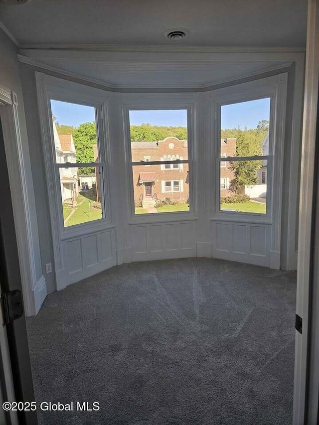 235 5th Ave, Troy, NY 12180 - unfurnished room with carpet flooring, a decorative wall, and crown molding
